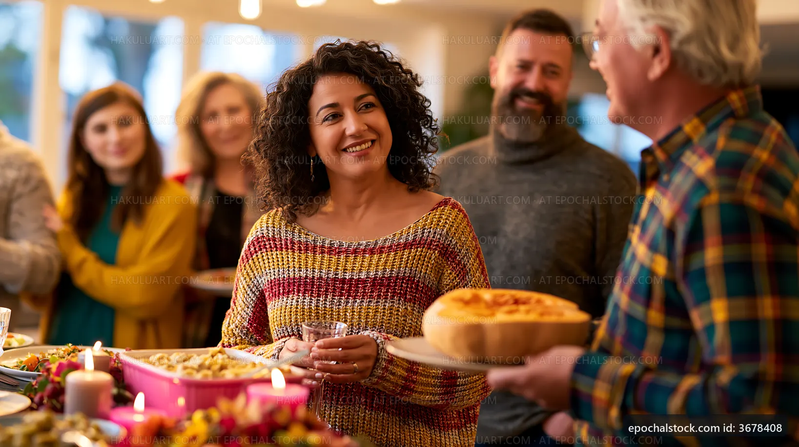 Friends gather at a party enjoying food and drinks together