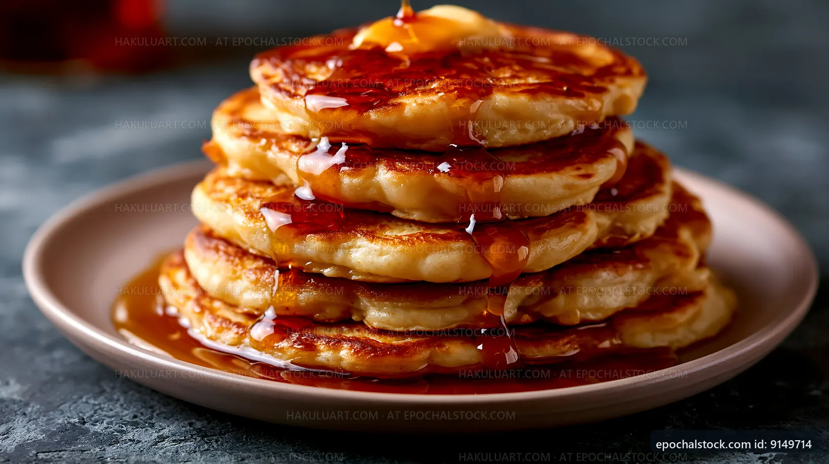 Stack of pancakes with syrup on a plate