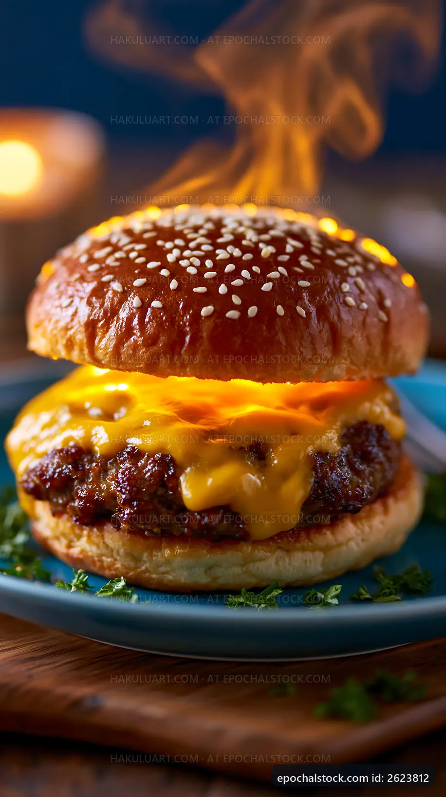 Hot cheeseburger with melted cheese on a sesame seed bun