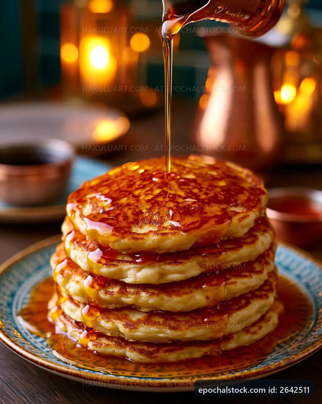 Stack of pancakes with syrup on a plate in a cozy setting