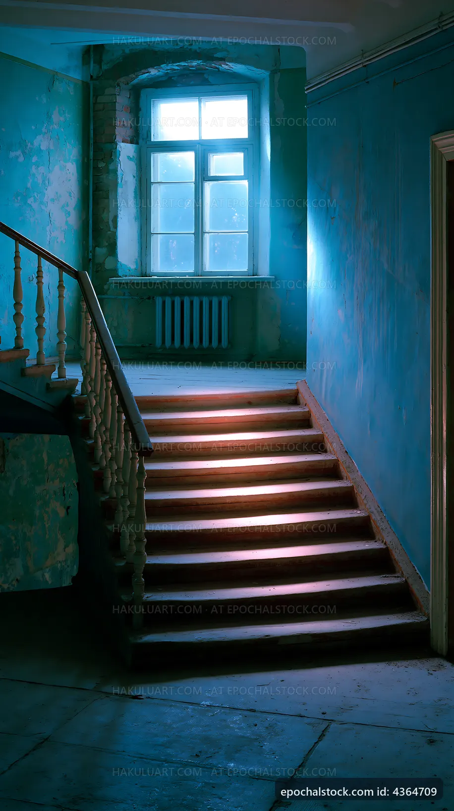 Staircase with blue walls and window light in old building