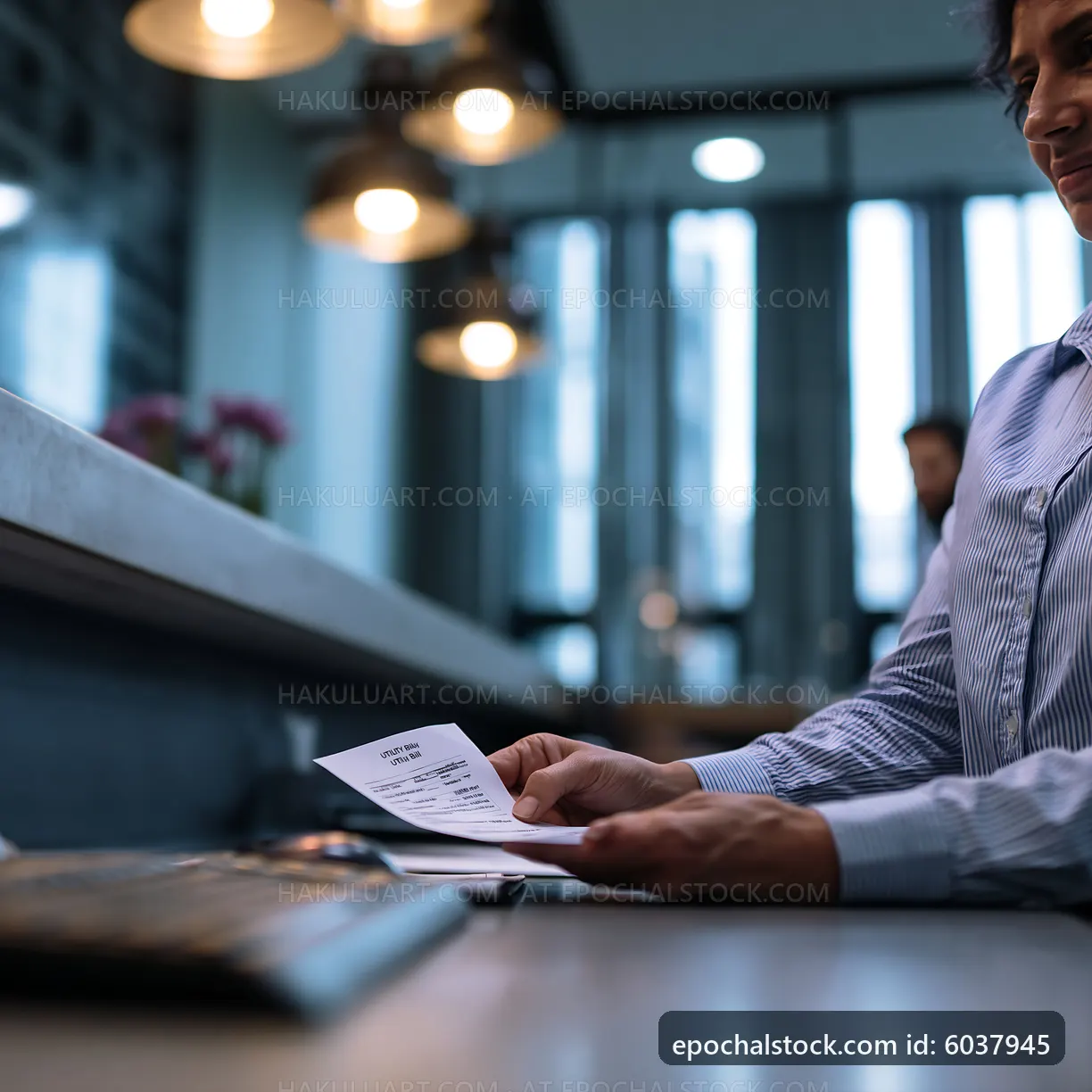 Person reviewing a receipt in a modern cafe setting