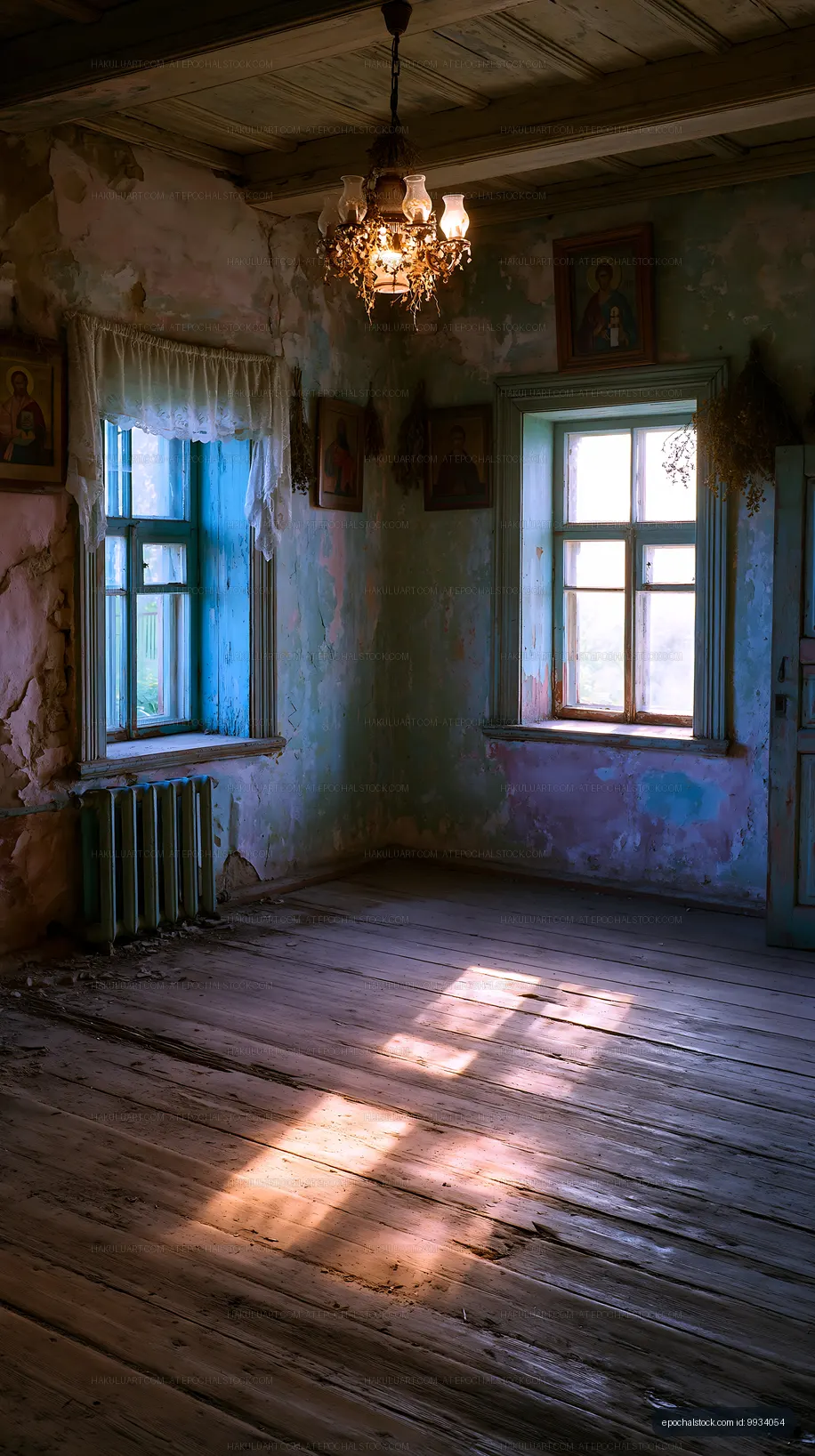 Old room with peeling paint and a chandelier in natural light