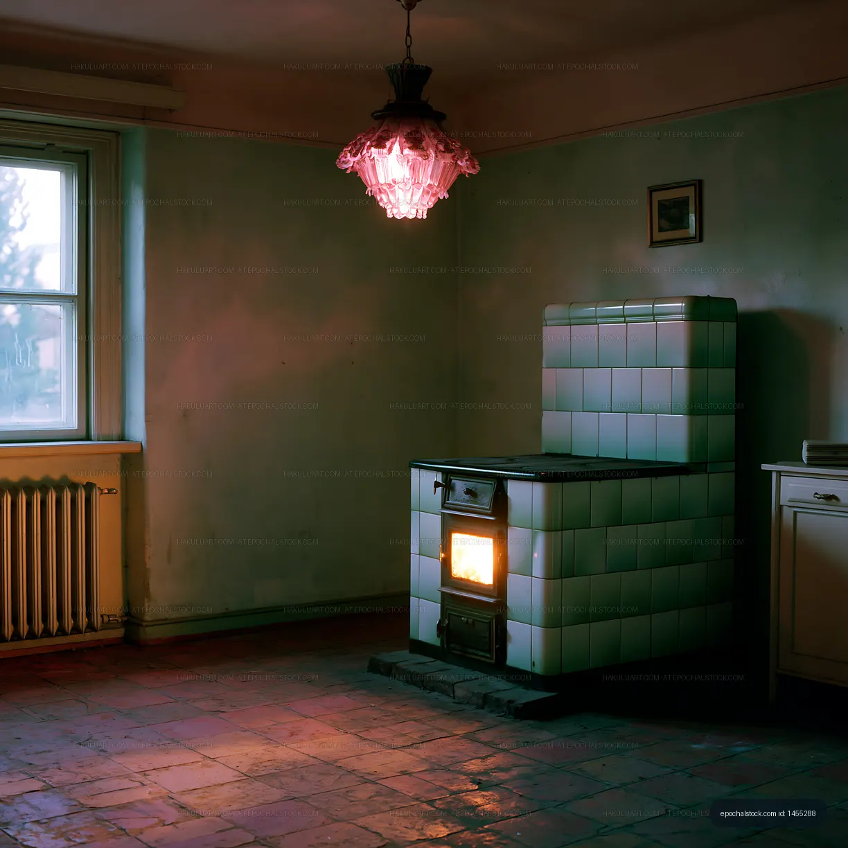 Old kitchen with a stove and light fixture in a vacant room