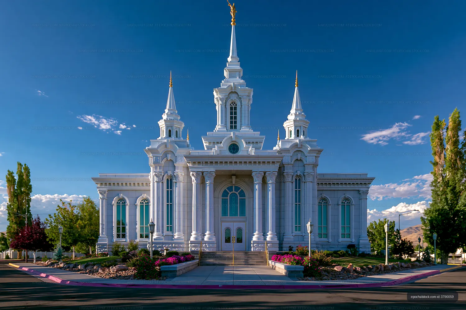 Stately white church with spires under clear blue sky