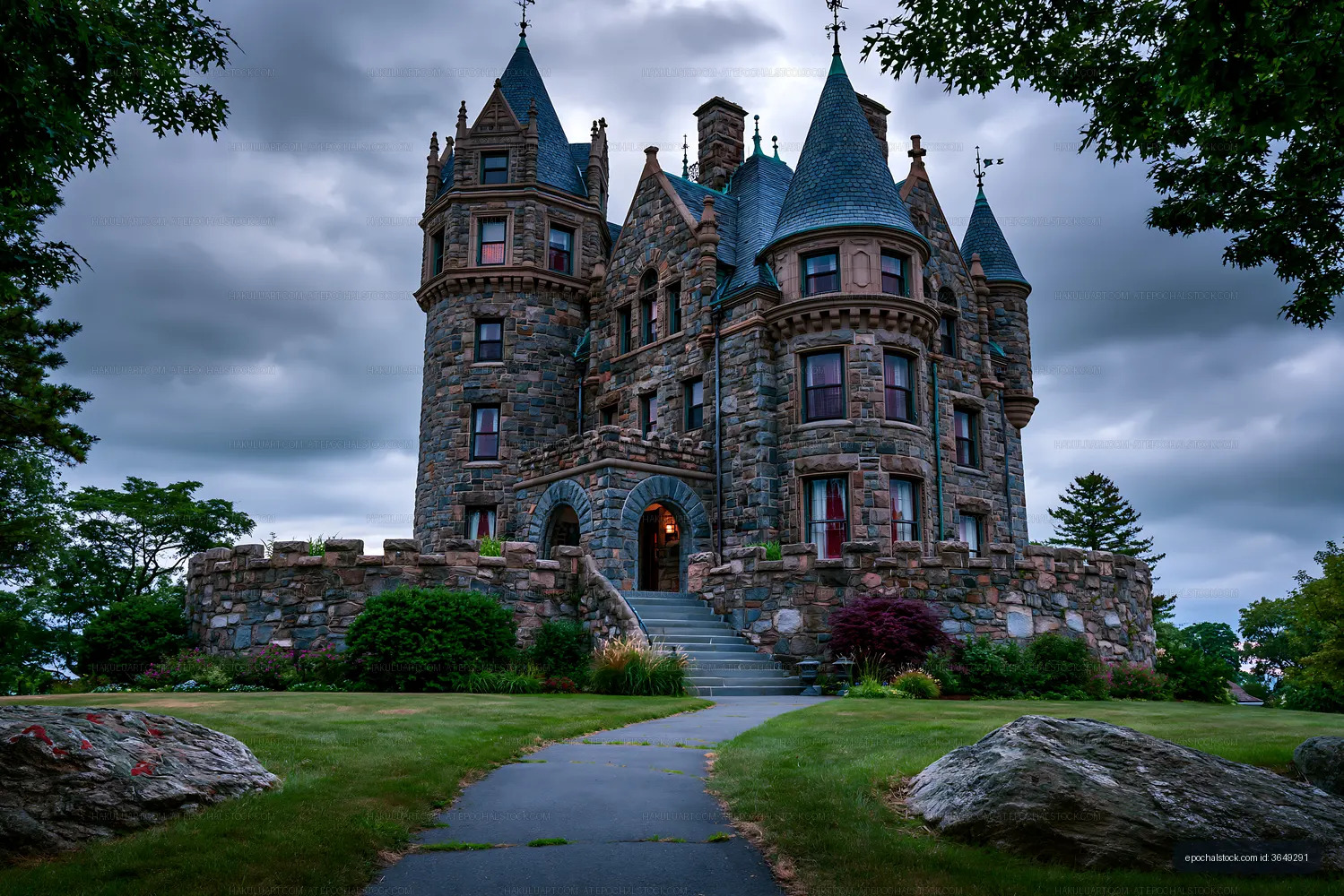 Stone castle with towers under cloudy sky