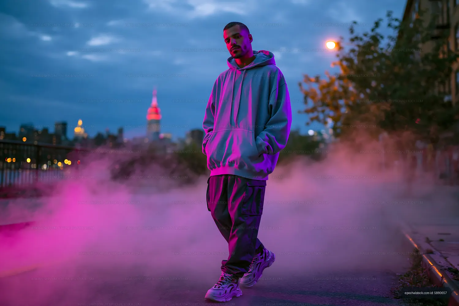 Man walking in urban setting with fog at dusk