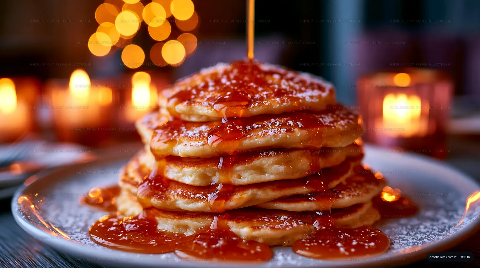 Stack of pancakes with syrup on a plate