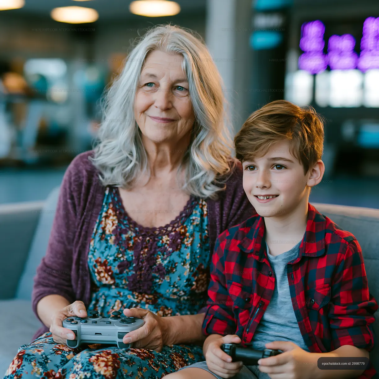 Grandmother and grandson playing video games together indoors