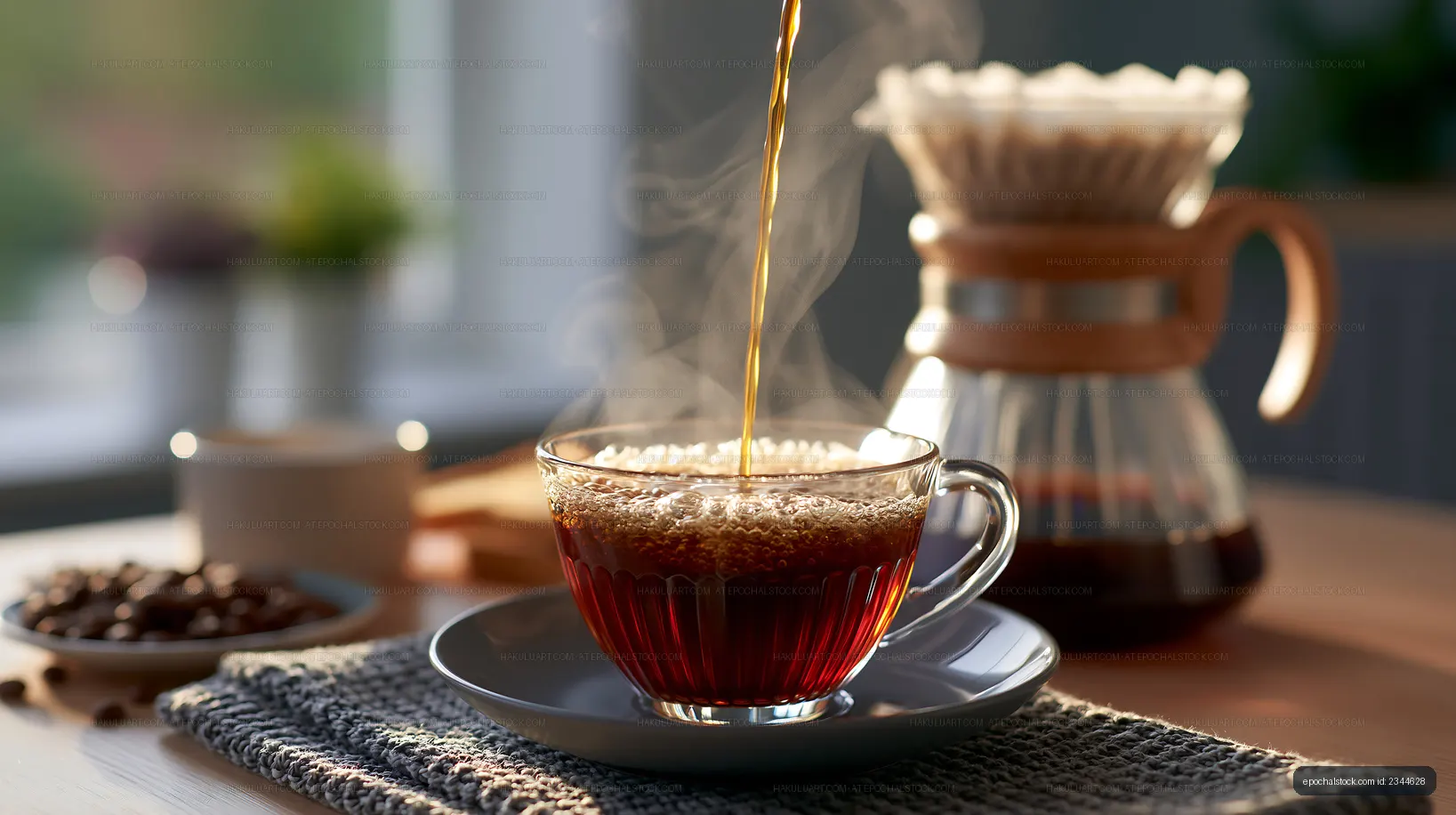 Coffee is brewed in a glass cup on a wooden table