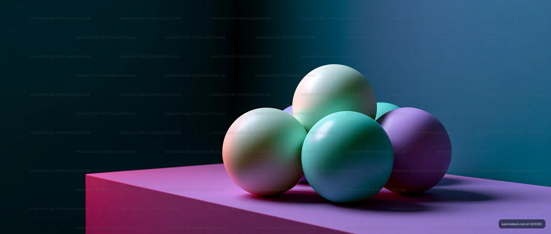 Colored spheres arranged on a pink surface against a blue background