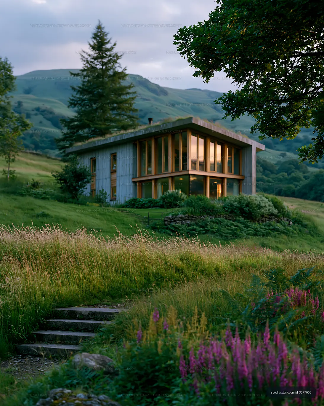 Modern house in green landscape under cloudy sky