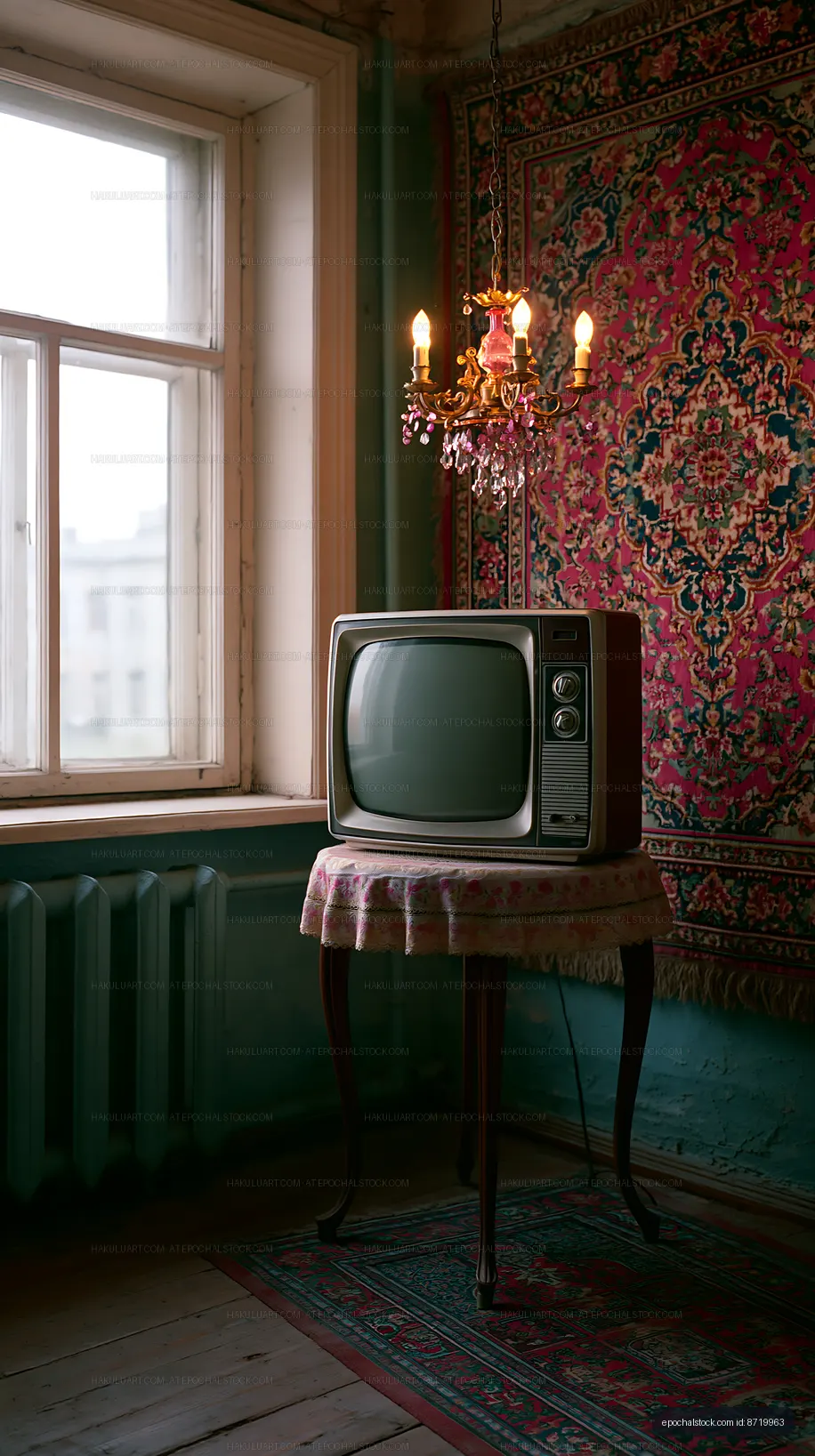 Vintage television in a room with a chandelier and patterned wallpaper