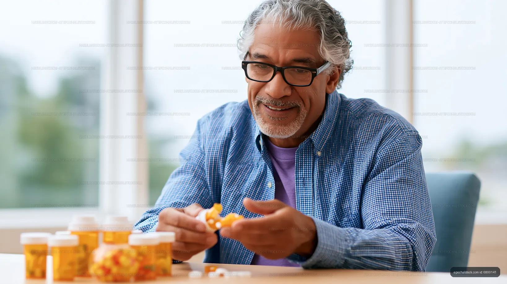 Senior man organizing medication at home