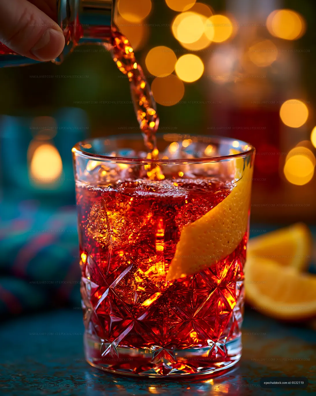Pouring soft drink into a glass with ice and citrus garnish
