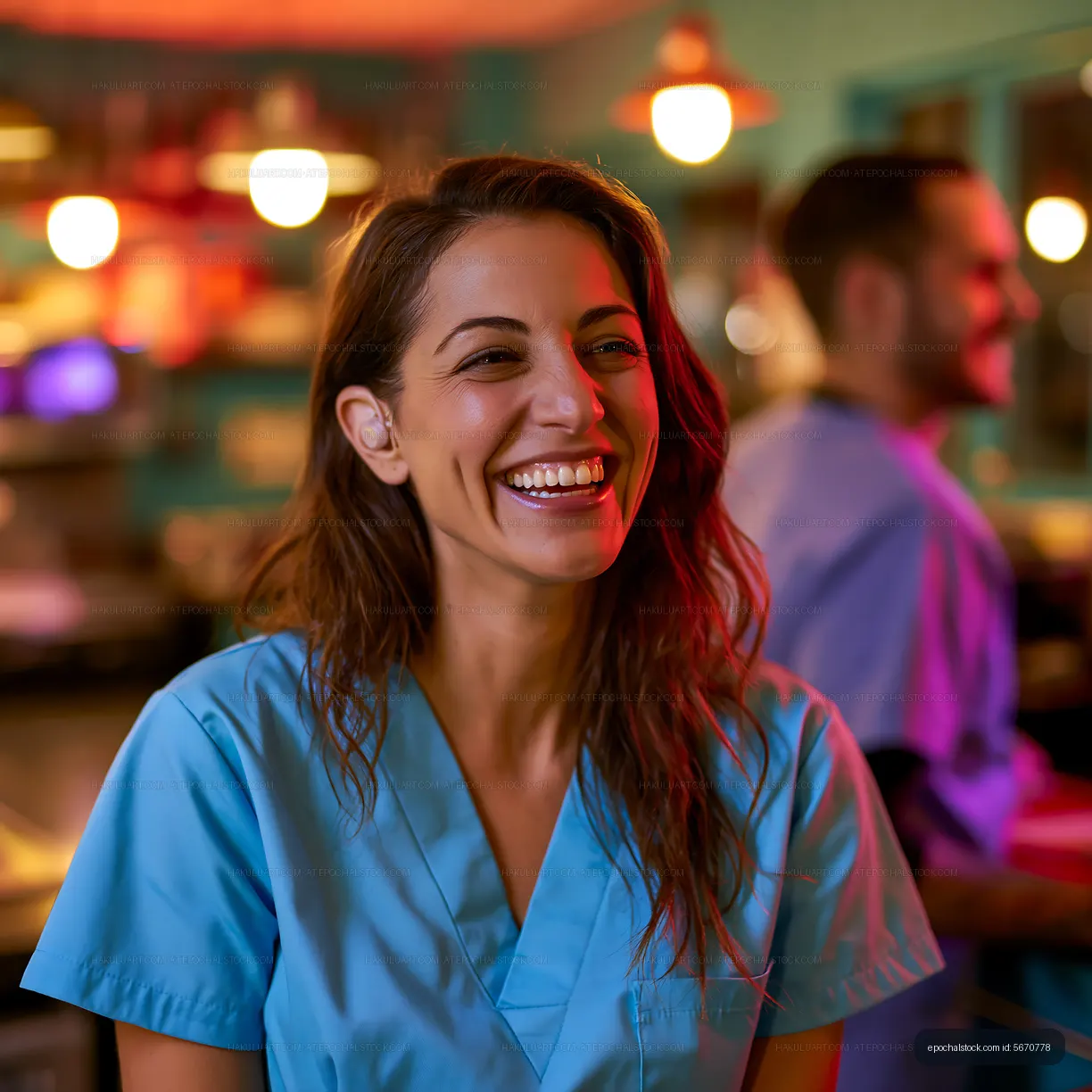 Healthcare workers smiling in a restaurant kitchen setting