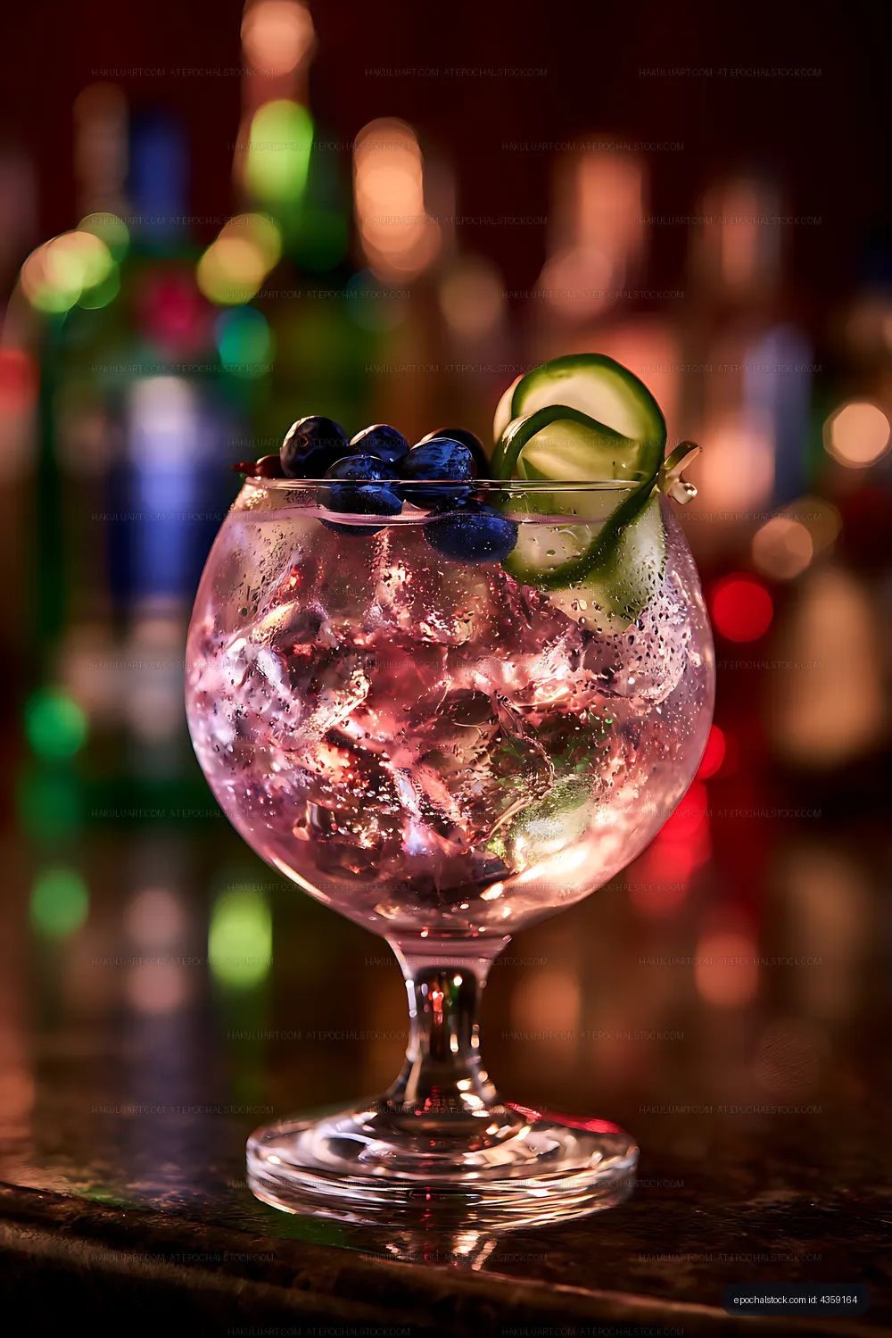 Cocktail with blueberries and cucumber in a bar setting