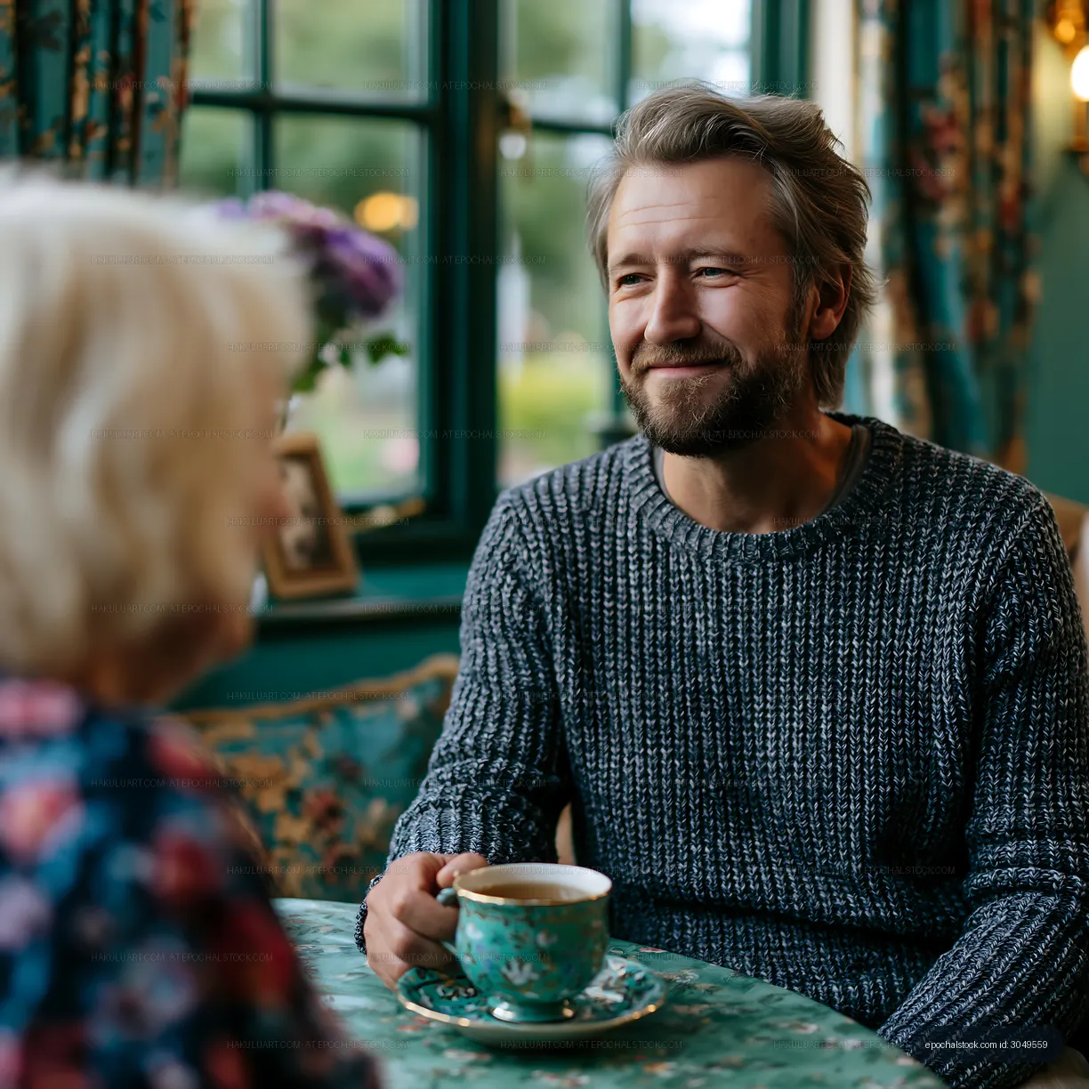 Man and woman enjoying coffee conversation in a cozy cafe