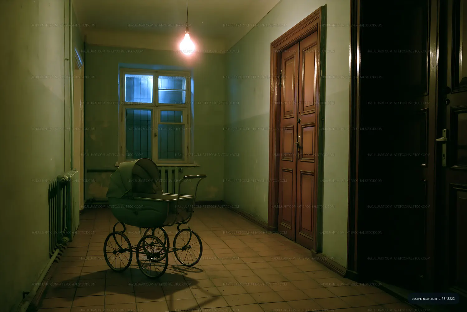 Empty hallway with a vintage baby stroller at night