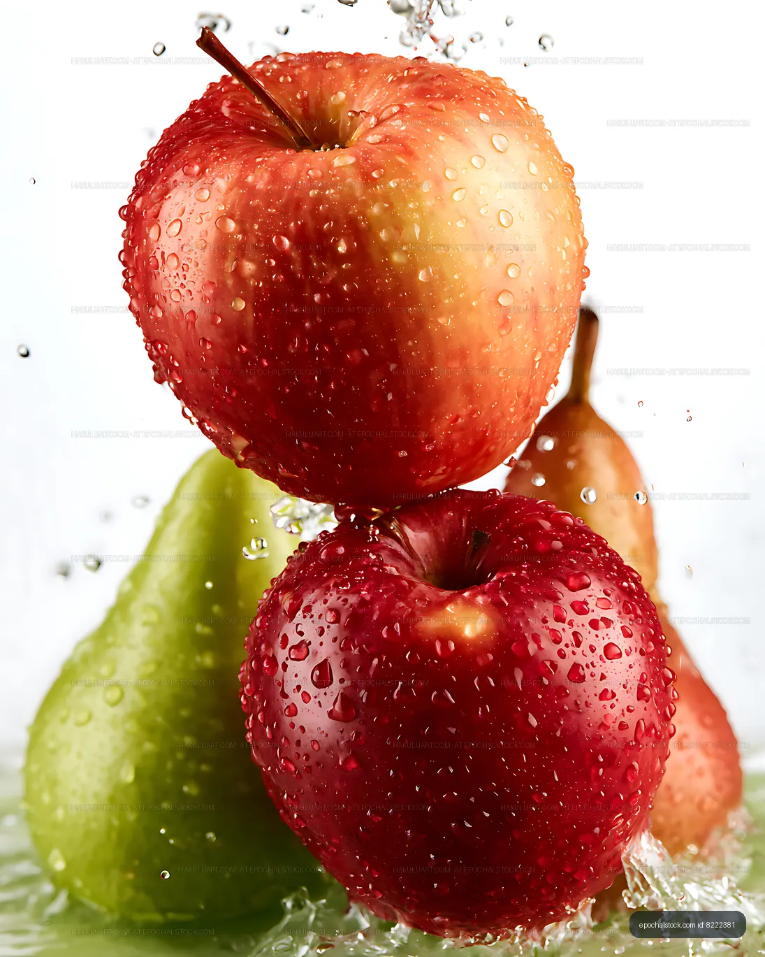 Fresh apples and pears with water droplets on a light background