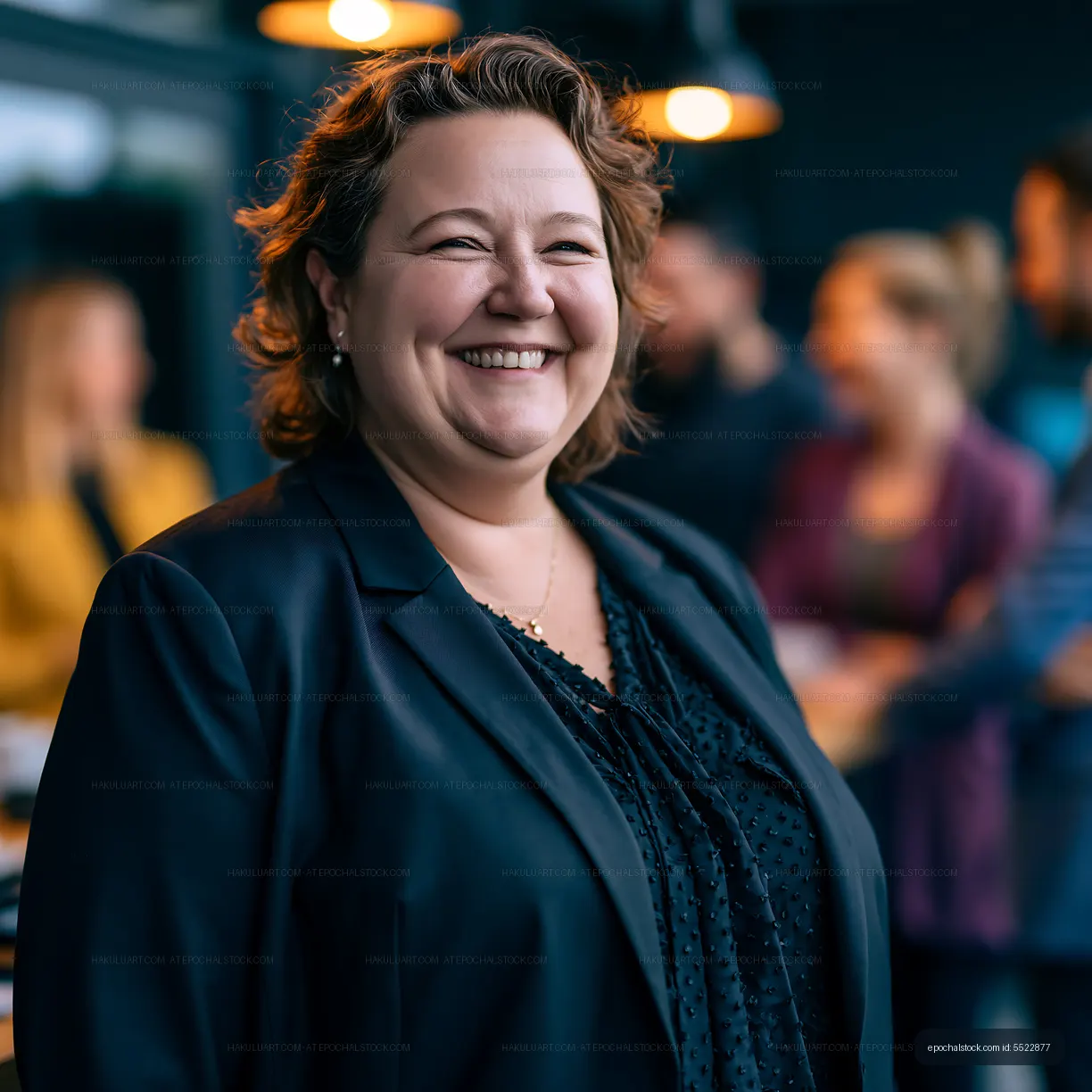 Professional woman smiling in a business meeting setting