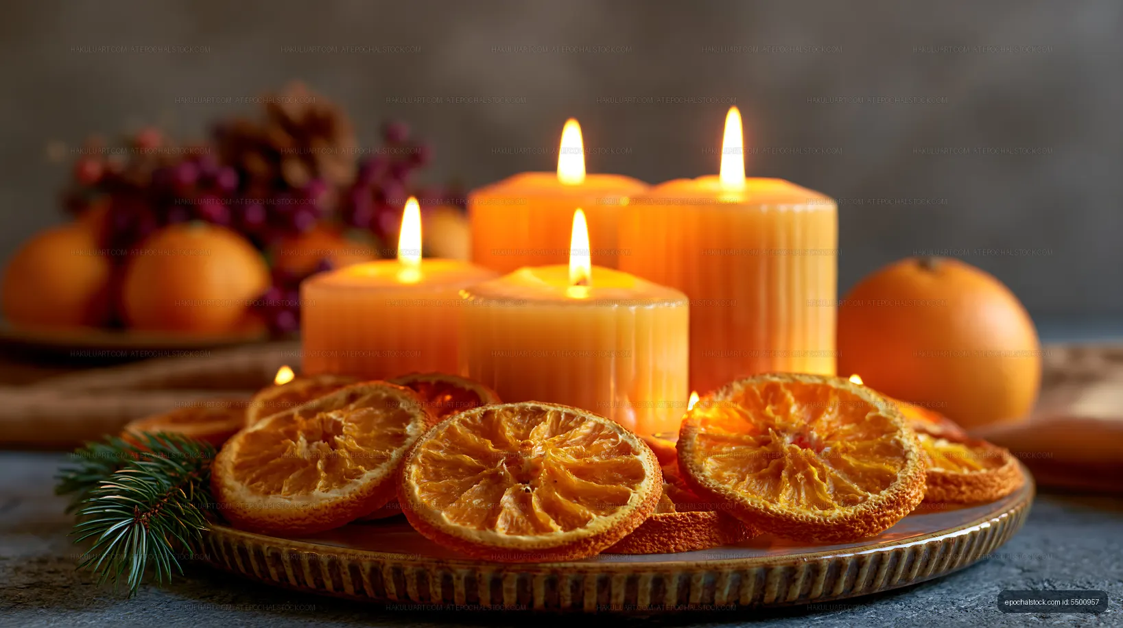 Candle display with dried orange slices on a festive table