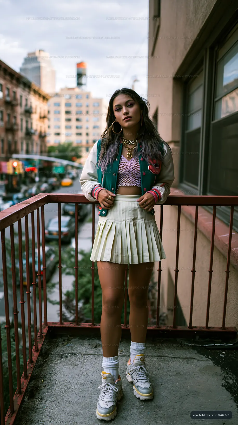 Streetwear portrait of a woman on an urban rooftop balcony