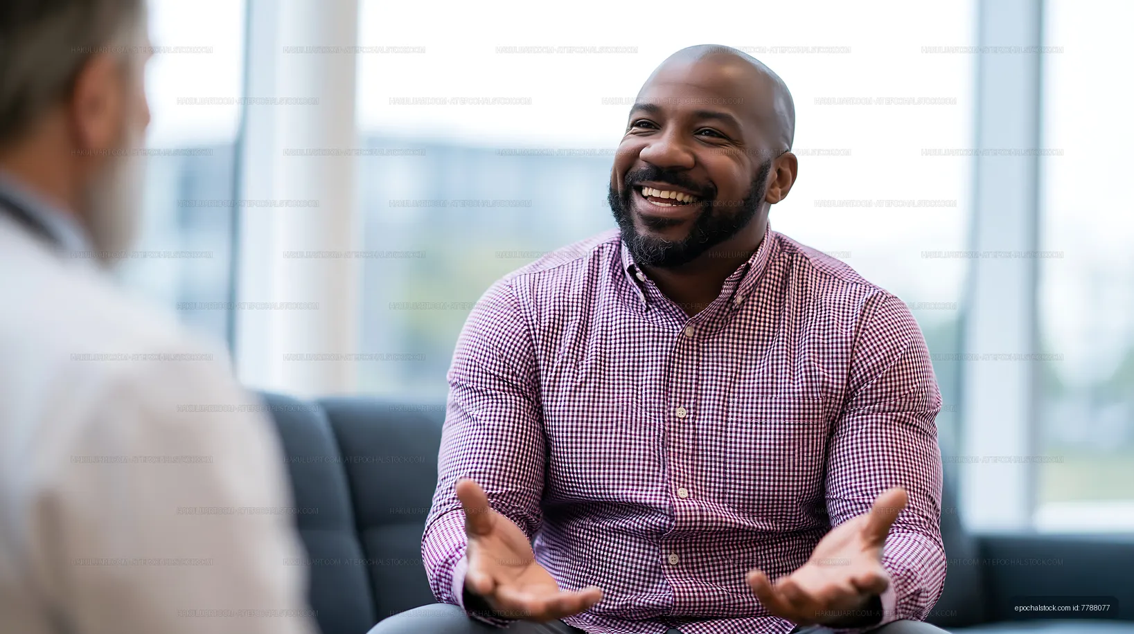 Smiling professional gesturing while speaking with a colleague