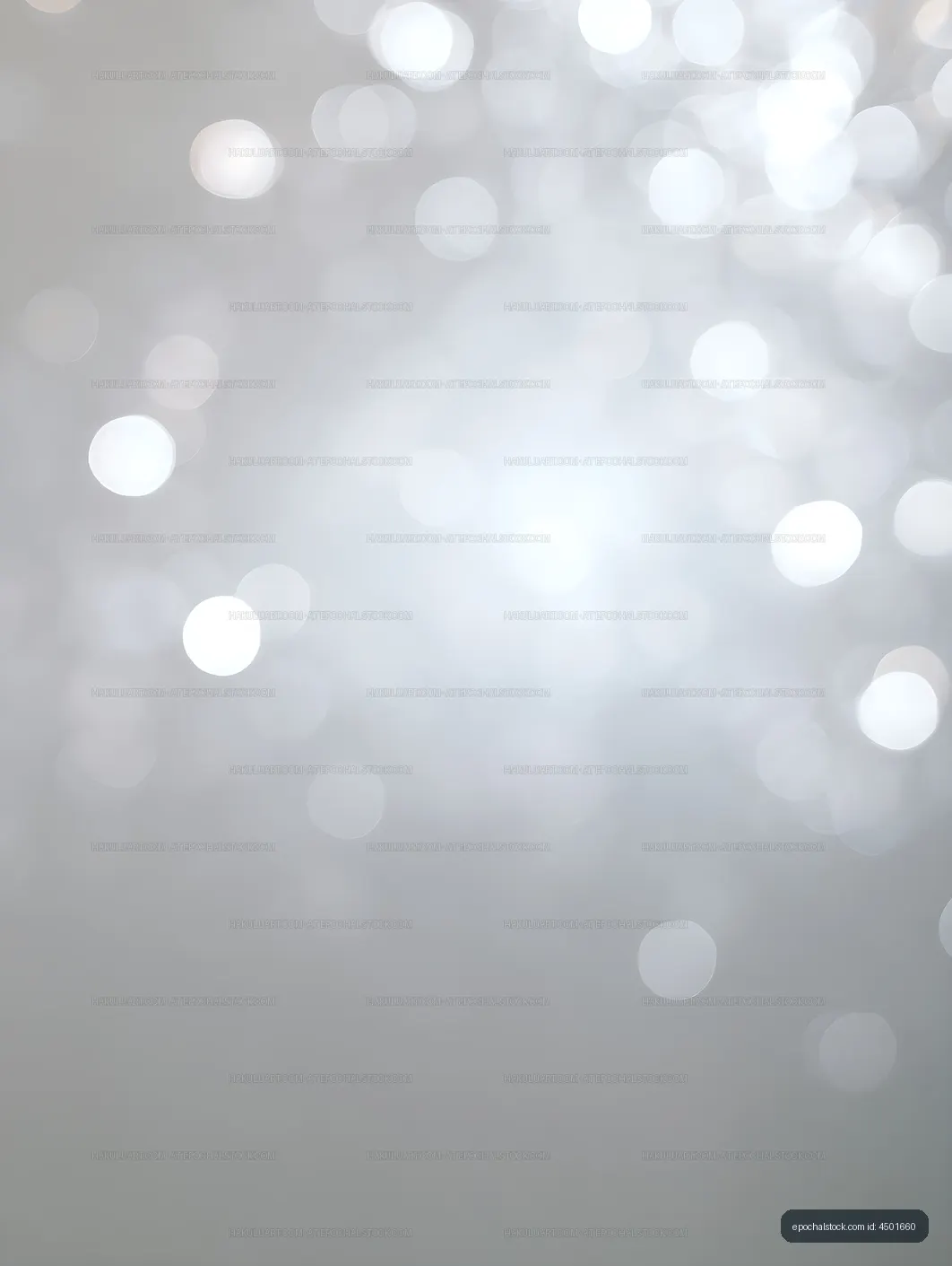 Soft glowing bokeh circles fading across a gray background
