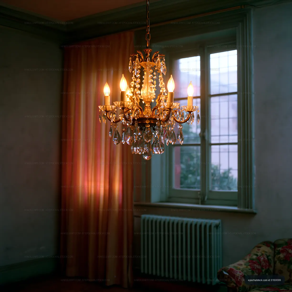 Glowing crystal chandelier against tall windows