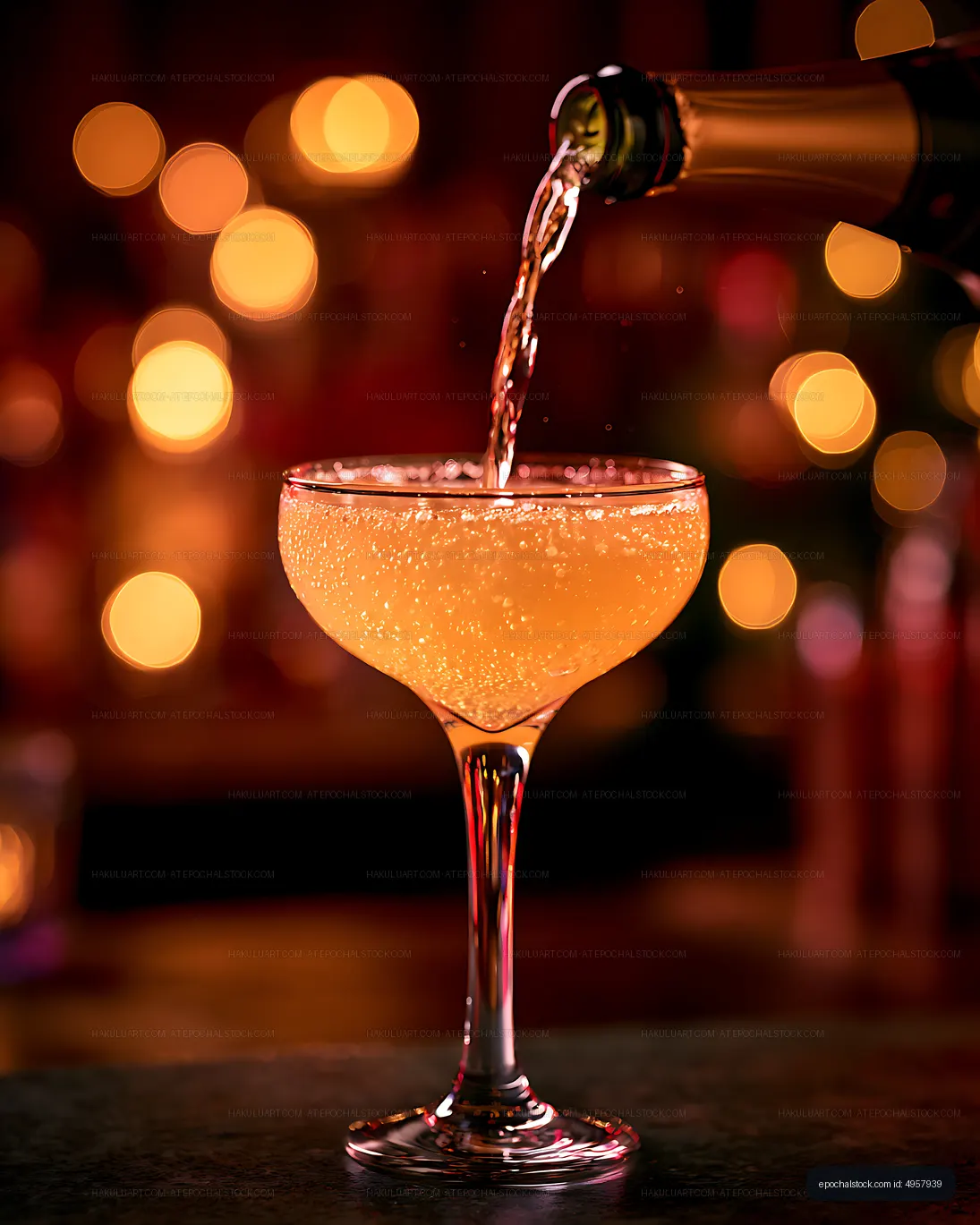 Sparkling orange cocktail poured into coupe glass