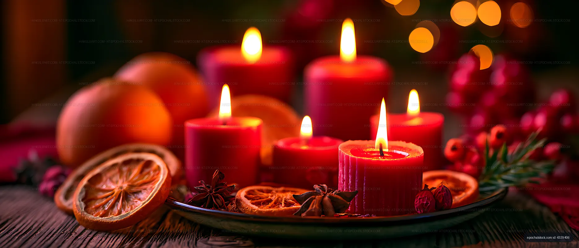 Festive candle arrangement with citrus and berries