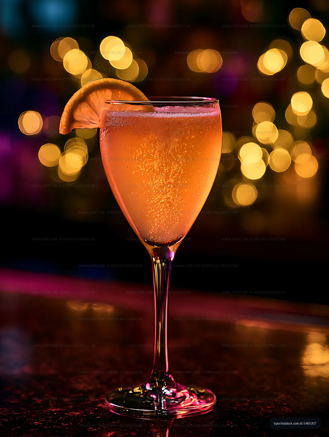 Bubbly amber citrus drink with orange garnish