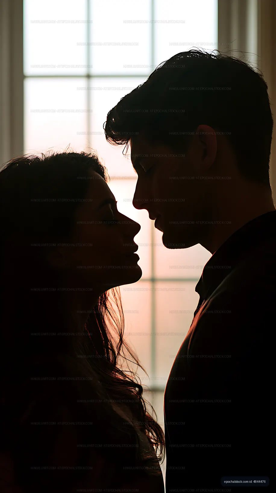 Backlit couple sharing an intimate moment