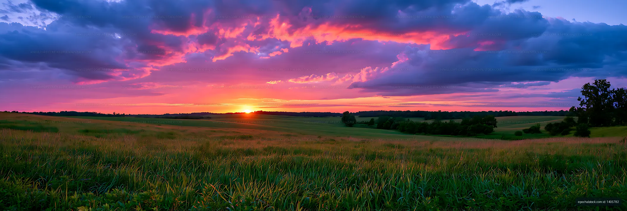 Panoramic rural fields beneath a dramatic sunset