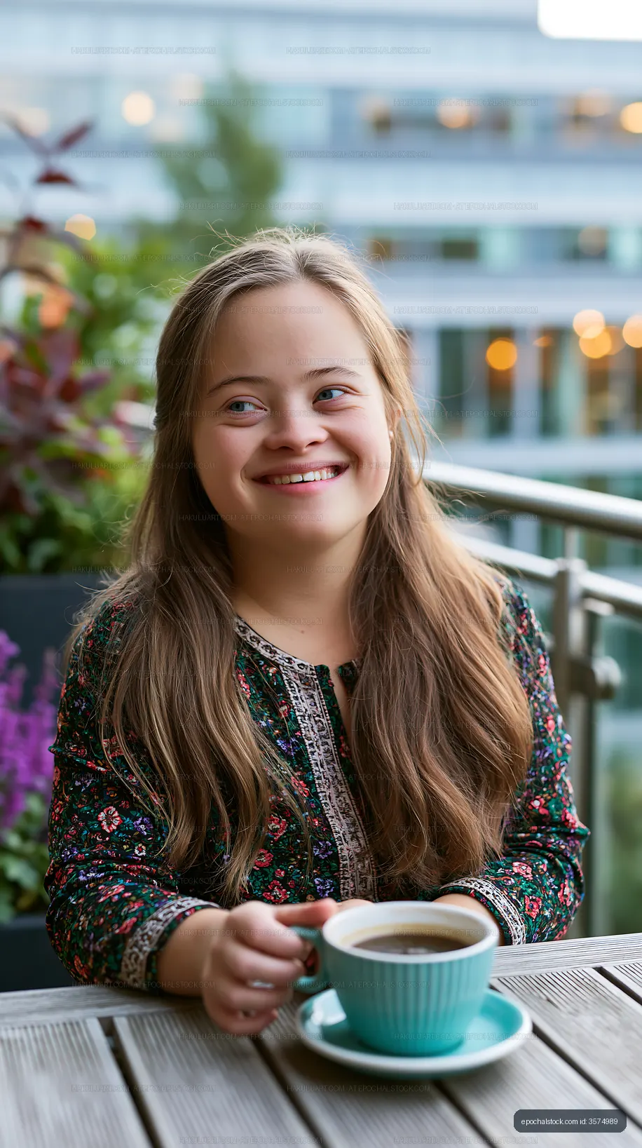 Portrait of a smiling girl with coffee outdoors