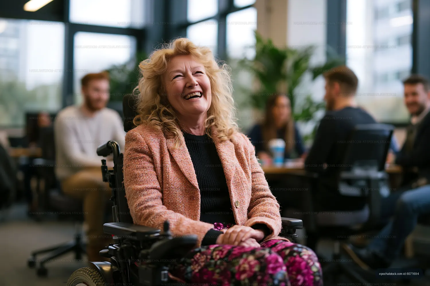 Happy woman laughing while seated in a wheelchair