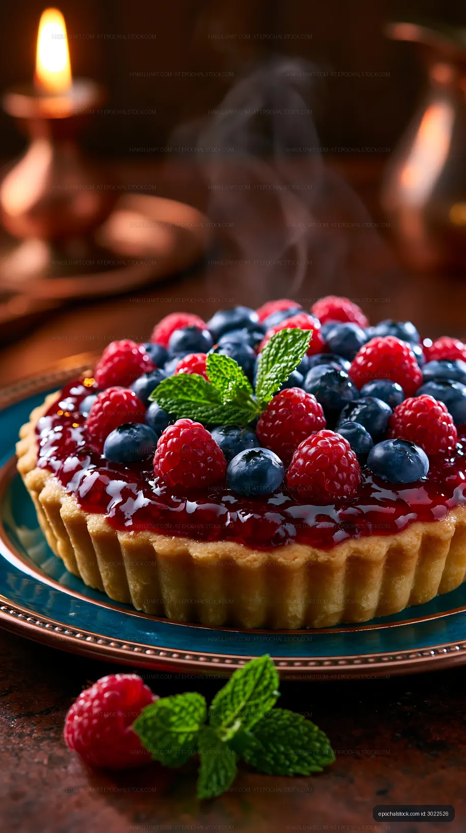 Raspberry and blueberry tart in warm candlelight