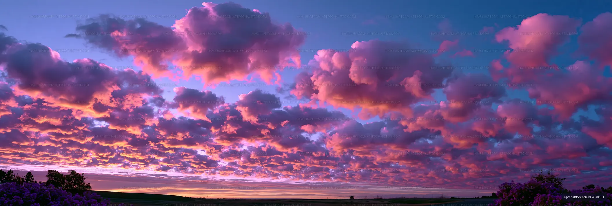 Dramatic sunset clouds over a quiet rural landscape