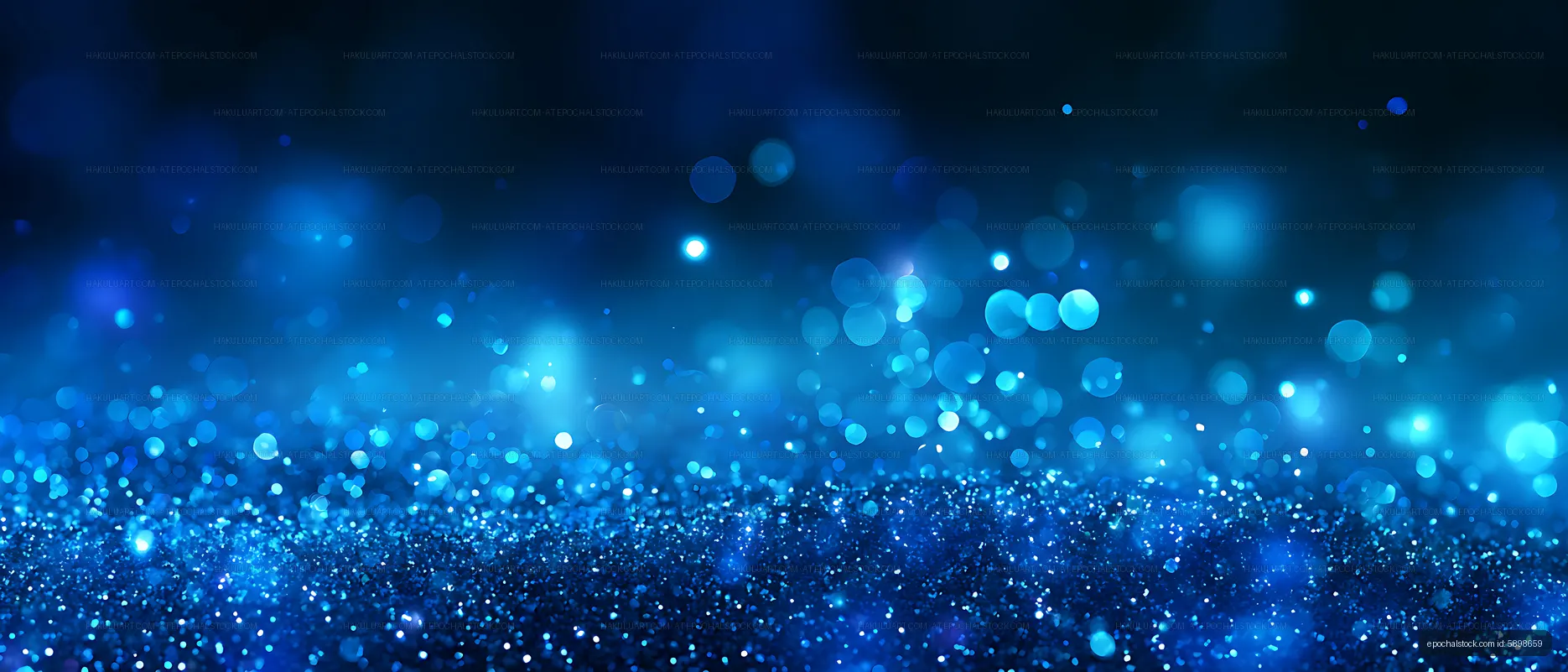Abstract blue glitter surface with soft glowing bokeh