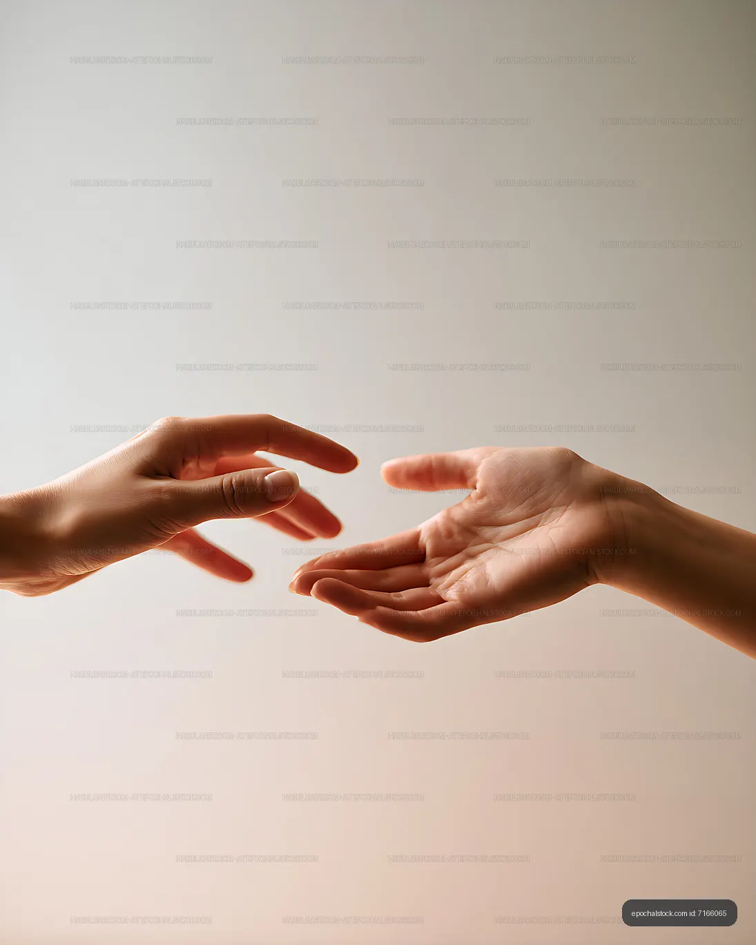 Human hands reaching toward each other with copy space