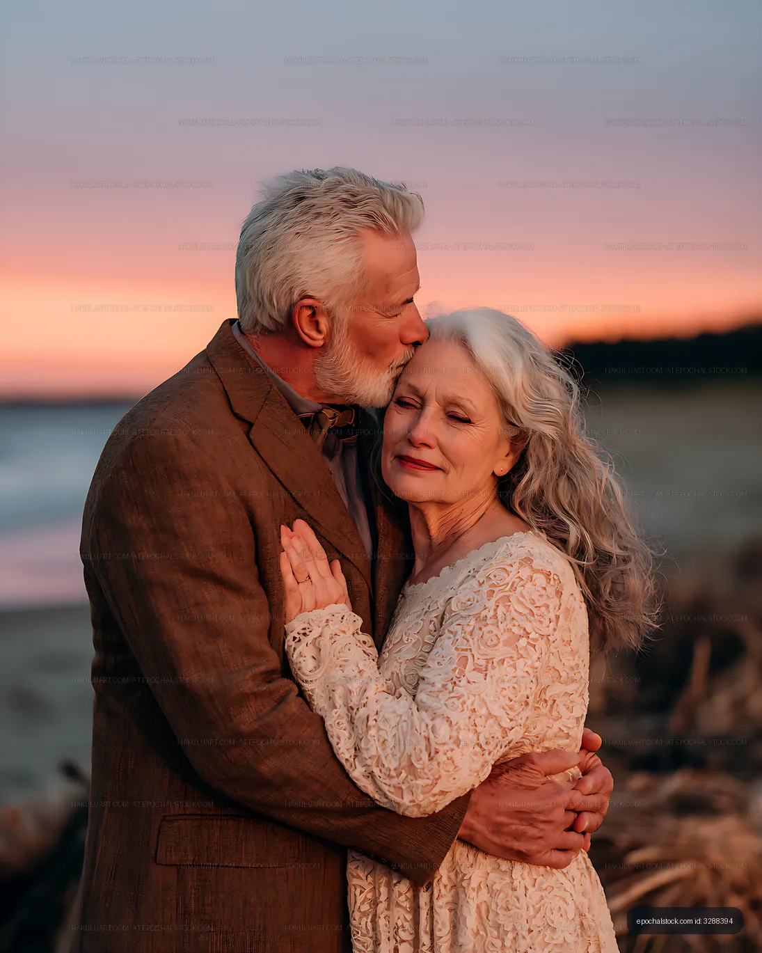 Tender senior couple portrait beside the sea at sunset