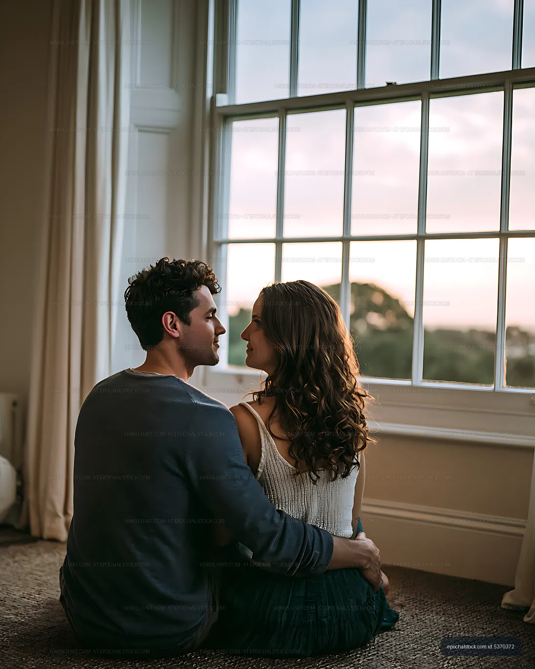 Intimate couple portrait in warm window light