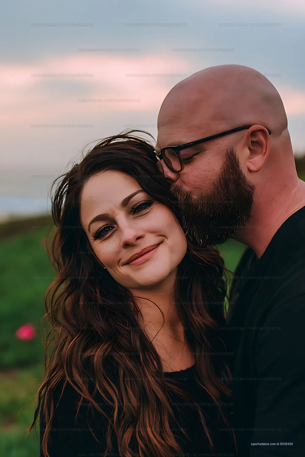 Close portrait of a couple embracing in soft evening light