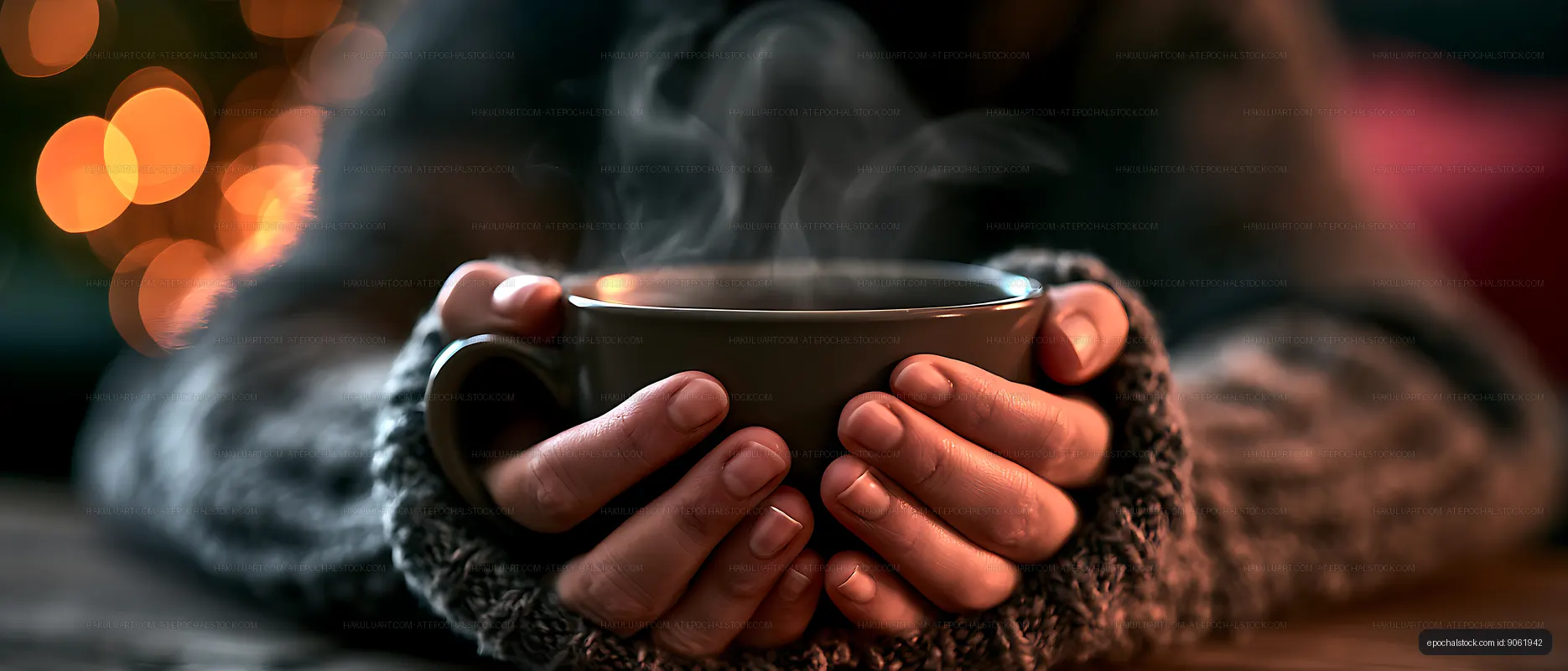 Cozy close-up of a person holding a steaming cup