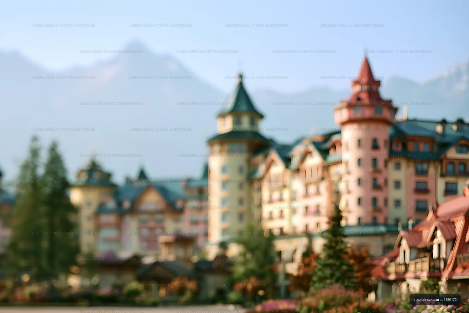 Colorful alpine resort buildings with mountain backdrop