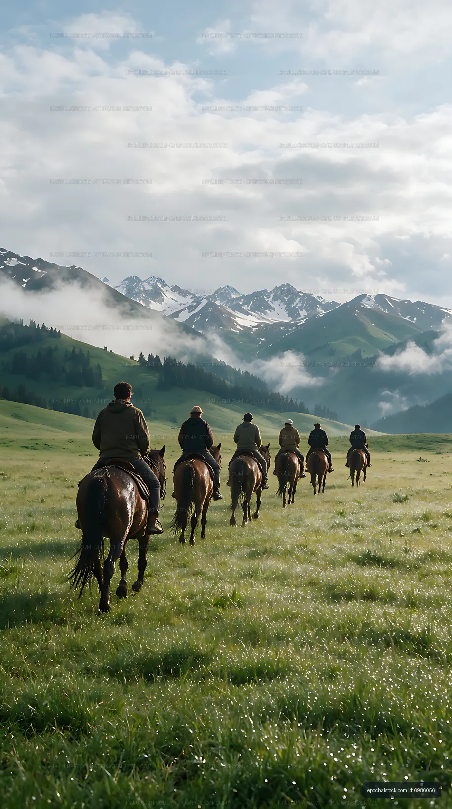 Six riders on horseback in an alpine meadow