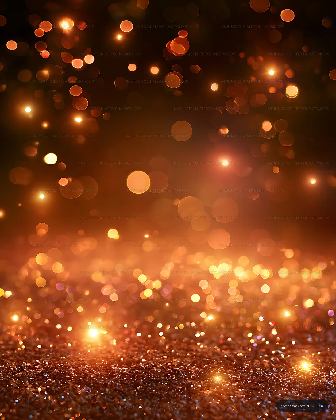 Orange and gold bokeh lights above a glittering surface
