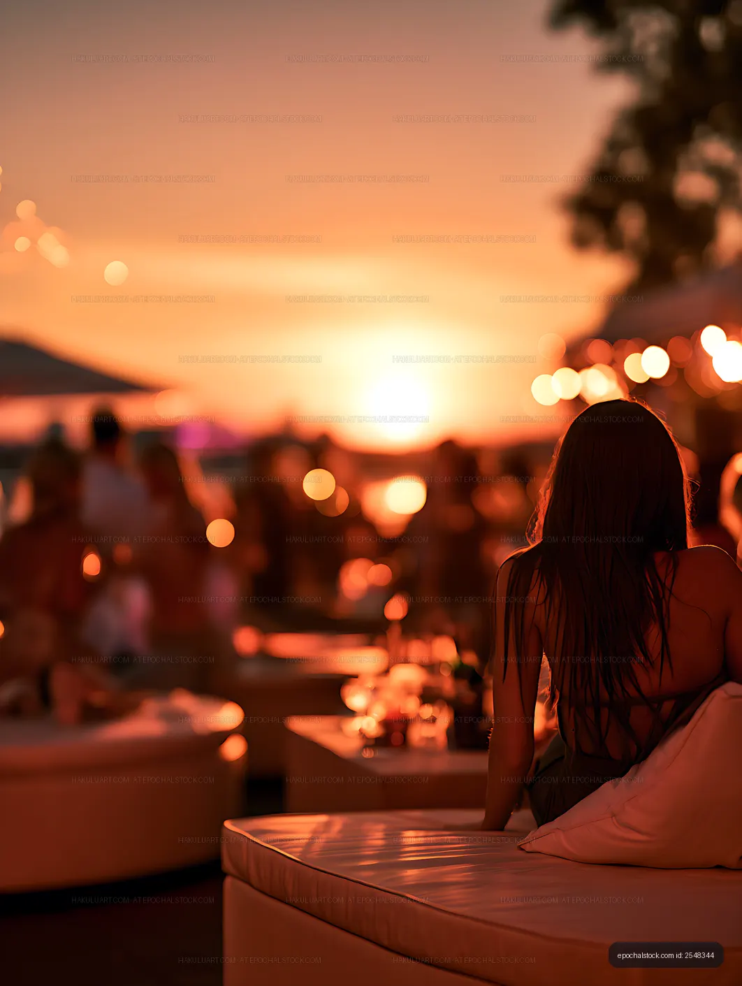 Back View of Woman Enjoying a Rooftop Sunset