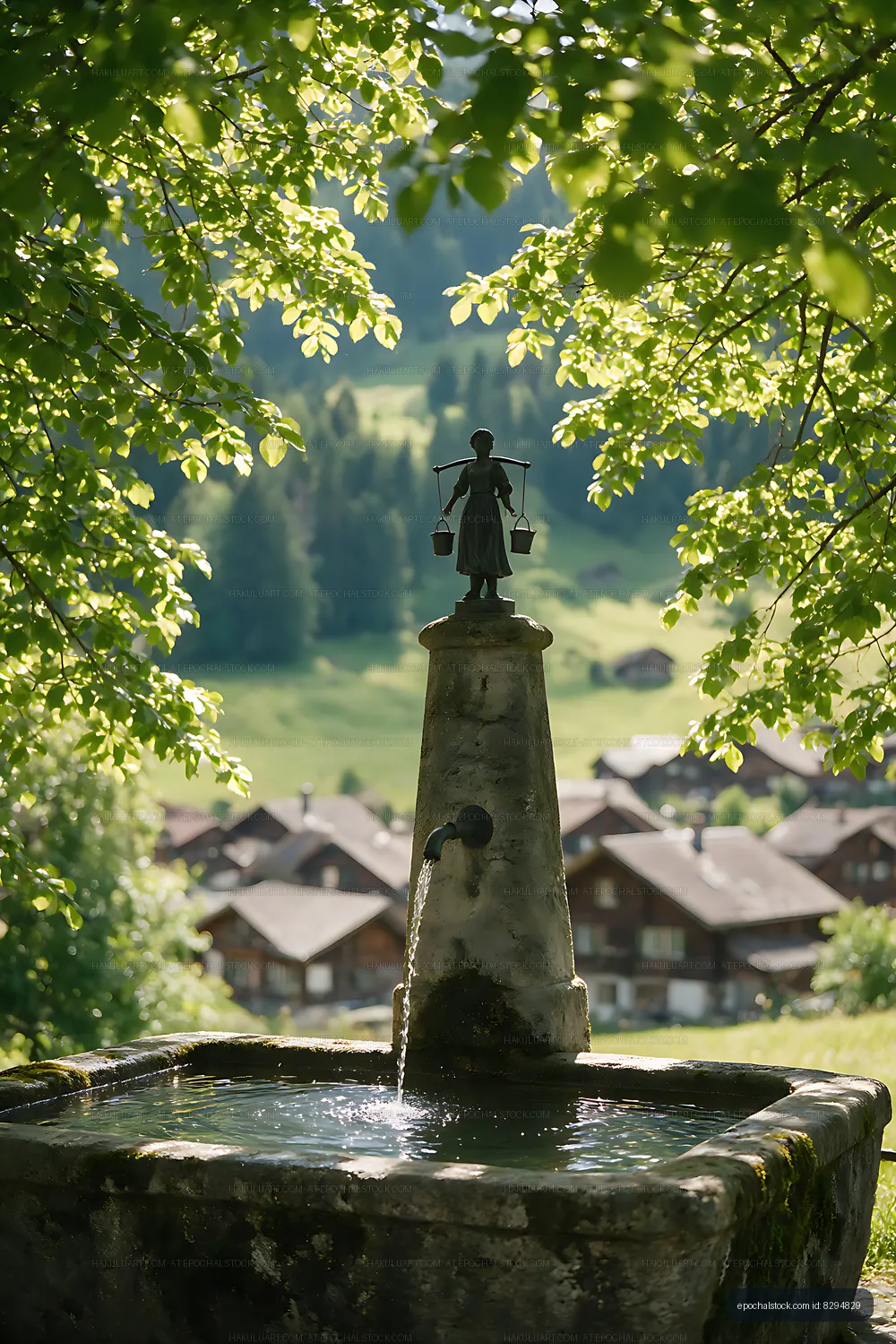 Stone Swiss Village Fountain with Alpine Village View
